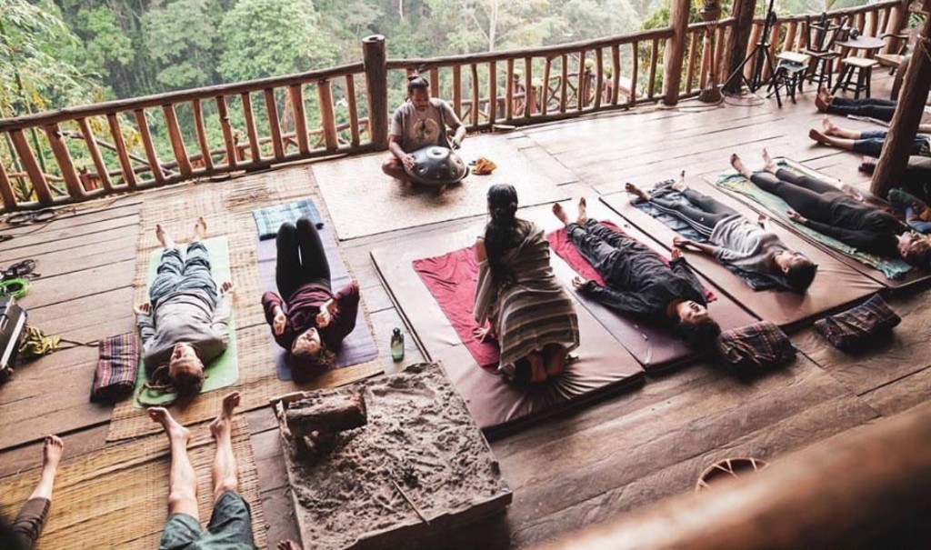 Group sound session on retreat deck