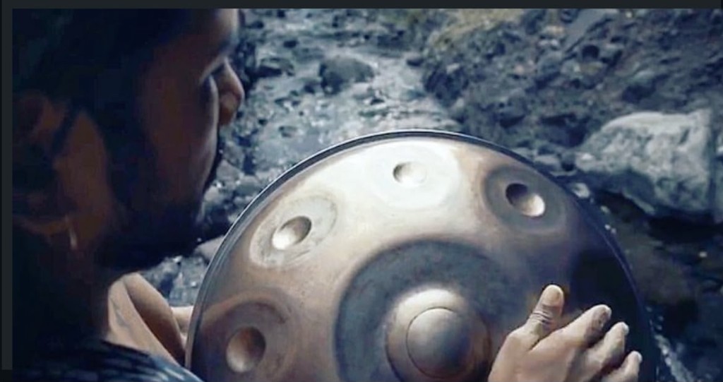 Merkaba handpan bronze close-up by a stream